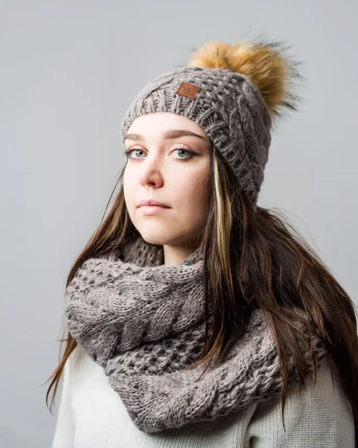 Grey pom-pom beanie with a chunky cable snood
